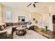Inviting living room with a plush sectional, slate floors, and neutral decor at 10798 Muscari Way, Las Vegas, NV 89141