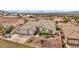 Aerial view of a well-maintained home showcases the landscaping and neighborhood at 1124 Whistle Ct, Henderson, NV 89011