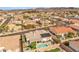 A captivating aerial view showcasing the home's backyard pool, landscaping, and neighborhood at 1124 Whistle Ct, Henderson, NV 89011