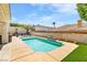 Backyard offers a sparkling pool, elegant landscaping, and serene privacy at 1124 Whistle Ct, Henderson, NV 89011