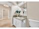 Elegant bathroom vanity with granite countertop, toilet and decorative flowers at 1124 Whistle Ct, Henderson, NV 89011