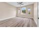 Bright bedroom featuring wood floors, and a large window at 1124 Whistle Ct, Henderson, NV 89011