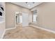 Comfortable bedroom featuring tile floors, built-in shelving, and a doorway to an adjoining room at 1124 Whistle Ct, Henderson, NV 89011