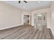 Inviting bedroom with hardwood floors, a ceiling fan and mirror closet doors at 1124 Whistle Ct, Henderson, NV 89011