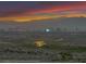 Breathtaking sunset view over the city skyline and snow-capped mountains in the distance at 1124 Whistle Ct, Henderson, NV 89011