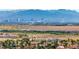 A scenic view overlooking homes, with the city skyline and majestic mountains as a backdrop at 1124 Whistle Ct, Henderson, NV 89011