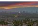 Scenic view showcasing the city skyline and mountain range during a stunning sunset at 1124 Whistle Ct, Henderson, NV 89011
