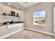 Charming dining area with granite counters, display shelving, and a large window offering neighborhood views at 1124 Whistle Ct, Henderson, NV 89011