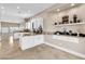 Open dining area featuring granite counters, display shelving, and easy access to the kitchen at 1124 Whistle Ct, Henderson, NV 89011