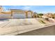 Beautiful single-story home featuring stone accents, a three-car garage, and well-maintained landscaping at 1124 Whistle Ct, Henderson, NV 89011