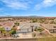 Inviting single-story home with a three-car garage, manicured landscaping, and picturesque surroundings at 1124 Whistle Ct, Henderson, NV 89011