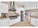 Gourmet kitchen featuring stainless steel appliances, granite countertops, and a decorative backsplash at 1124 Whistle Ct, Henderson, NV 89011