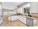 Modern kitchen featuring white cabinetry, granite countertops, and stainless steel appliances at 1124 Whistle Ct, Henderson, NV 89011