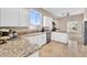 Bright kitchen with an island, granite countertops, stainless steel appliances, and abundant natural light at 1124 Whistle Ct, Henderson, NV 89011