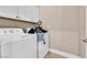 Bright laundry room featuring a white washer and dryer at 1124 Whistle Ct, Henderson, NV 89011