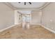 Spacious living room with travertine tile flooring and neutral color palette at 1124 Whistle Ct, Henderson, NV 89011