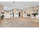 Open floor plan showcasing living room, kitchen with stainless appliances and fireplace at 1124 Whistle Ct, Henderson, NV 89011