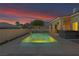 Lush backyard featuring a pool, hot tub, and meticulous landscaping, creating a serene and private retreat at 1124 Whistle Ct, Henderson, NV 89011