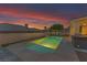 Beautiful pool with modern design and landscaping, perfect for relaxing and entertaining against a scenic sky at 1124 Whistle Ct, Henderson, NV 89011