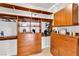 Bright, well-organized walk-in closet featuring custom wood shelving, drawers, and ample storage space at 1124 Whistle Ct, Henderson, NV 89011