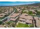 Aerial view of a community featuring desert landscapes, single-Gathering homes, and mountain views at 2805 Proust Ct, Henderson, NV 89044