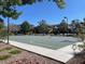 Outdoor basketball court in a community setting with trees, benches, and clear blue sky at 2805 Proust Ct, Henderson, NV 89044