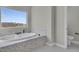 Bright bathroom with soaking tub, marble accents, and window view at 2805 Proust Ct, Henderson, NV 89044