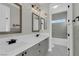 Bright bathroom features double vanity with sleek fixtures and tub, offering a modern and stylish space at 2805 Proust Ct, Henderson, NV 89044