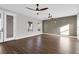 Spacious bonus room featuring wood floors, ceiling fans, and ample natural light from large windows at 2805 Proust Ct, Henderson, NV 89044
