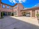 Back exterior of home with large yard and car port at 2805 Proust Ct, Henderson, NV 89044