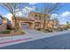 Exterior of a home featuring a porte-cochere and manicured landscaping at 2805 Proust Ct, Henderson, NV 89044