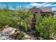 Inviting two-story home with mature trees, a tiled roof, and lush landscaping at 2805 Proust Ct, Henderson, NV 89044