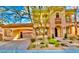 Home exterior featuring porte-cochere, landscaped front yard, and tiled roof at 2805 Proust Ct, Henderson, NV 89044