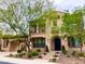 Beautiful house featuring manicured front lawn, desert vegetation, and porte-cochere at 2805 Proust Ct, Henderson, NV 89044