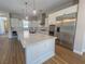 Bright kitchen with large island, stainless appliances, and modern pendant lighting at 2805 Proust Ct, Henderson, NV 89044