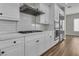 Kitchen boasts white cabinets, a gas range, stainless appliances, and a decorative tile backsplash at 2805 Proust Ct, Henderson, NV 89044