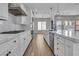 Kitchen features white cabinets, a kitchen island, and stainless steel appliances including a gas range at 2805 Proust Ct, Henderson, NV 89044