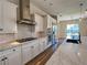Stylish kitchen featuring stainless steel appliances, large island, and subway tile backsplash at 2805 Proust Ct, Henderson, NV 89044