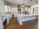 Well-appointed kitchen features stainless appliances, a large island and stylish lighting at 2805 Proust Ct, Henderson, NV 89044
