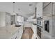 Gourmet kitchen showcasing stainless appliances, large island, and white cabinetry at 2805 Proust Ct, Henderson, NV 89044