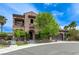 Attractive two-story stucco home featuring a second-story balcony and mature landscaping at 2824 Sisteron Ct, Henderson, NV 89044