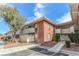 Inviting two-story exterior with landscaped yard, and ramp access for easy entry, all under a beautiful blue sky at 2866 Loveland Dr # 2017, Las Vegas, NV 89109