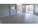 Open-plan living room features tile flooring and sliding glass doors to outdoor patio at 2866 Loveland Dr # 2017, Las Vegas, NV 89109