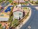 Aerial view of a home with meticulous landscaping, solar panels, and a rooftop patio at 301 Resolute Ave, Henderson, NV 89011