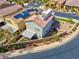 Aerial view of the house showcasing its solar panels, rooftop deck, landscaping, and neighborhood at 301 Resolute Ave, Henderson, NV 89011