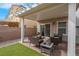 Charming covered patio with brick flooring, perfect for relaxation and backyard gatherings at 301 Resolute Ave, Henderson, NV 89011