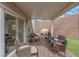 Covered brick patio with ample seating, perfect for outdoor dining and entertaining with ease at 301 Resolute Ave, Henderson, NV 89011