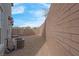 Backyard with gravel landscaping, privacy wall, and a gated entrance at 301 Resolute Ave, Henderson, NV 89011
