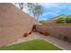 Backyard features an artificial lawn area, gravel bed, and small decorative fountain at 301 Resolute Ave, Henderson, NV 89011