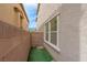 Backyard features low maintenance landscaping, artificial lawn, and privacy walls at 301 Resolute Ave, Henderson, NV 89011